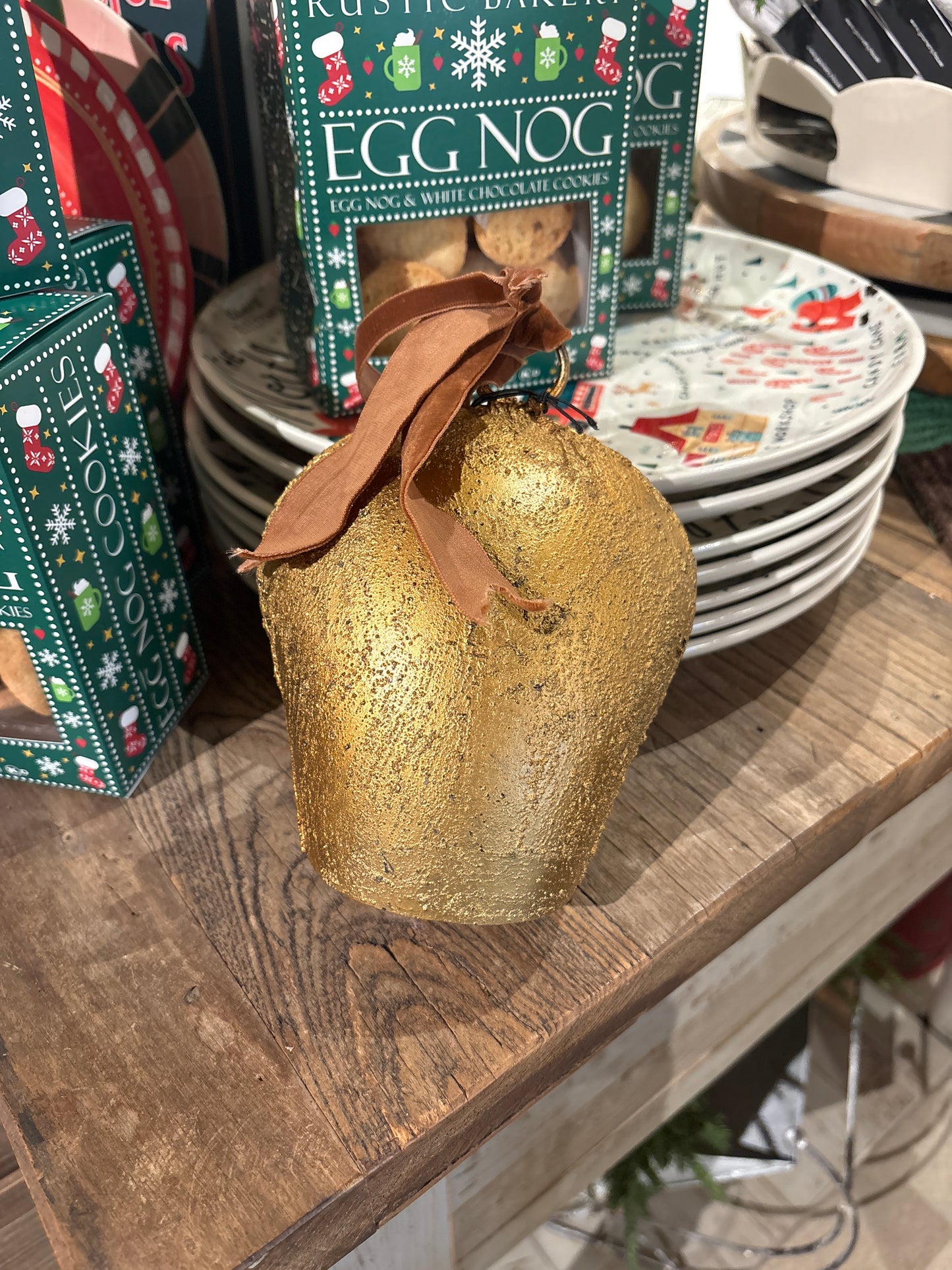 Large metal bell with brown velvet